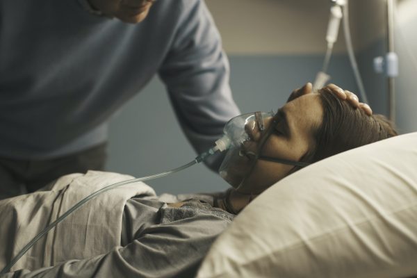 Caring father assisting her daughter at the hospital